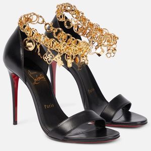 Christian Louboutin Black and Gold Heels